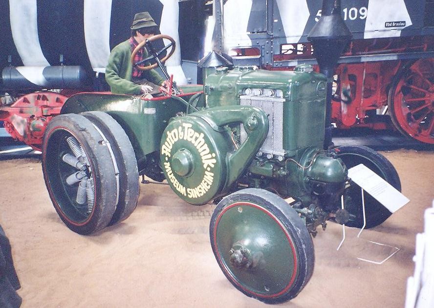 Tractor with spring wheels